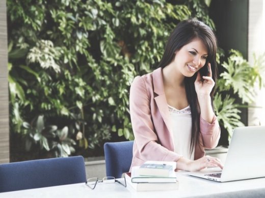 Female at a desk on the phone